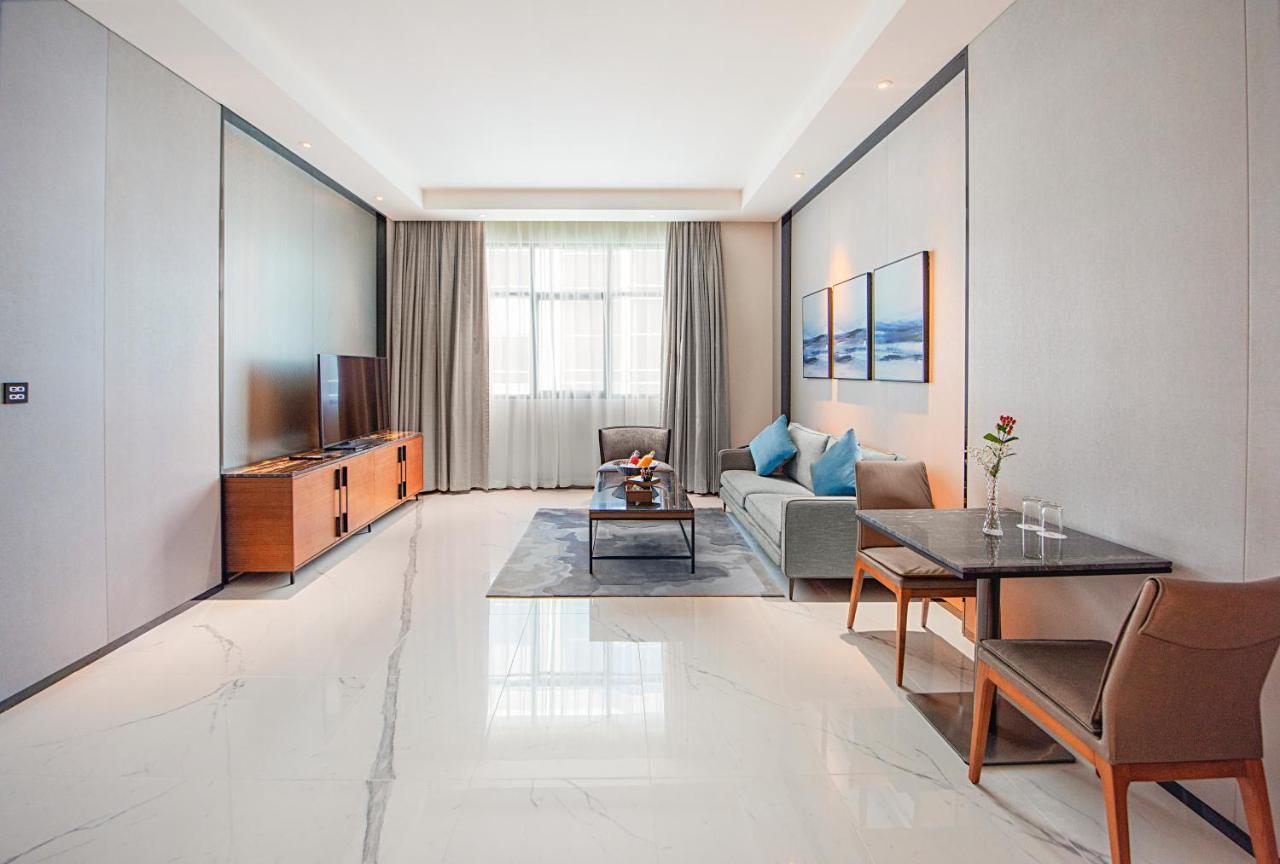 Asiana Grand Hotel ดูไบ ภายนอก รูปภาพ A living room in a serviced apartment in Beijing, China